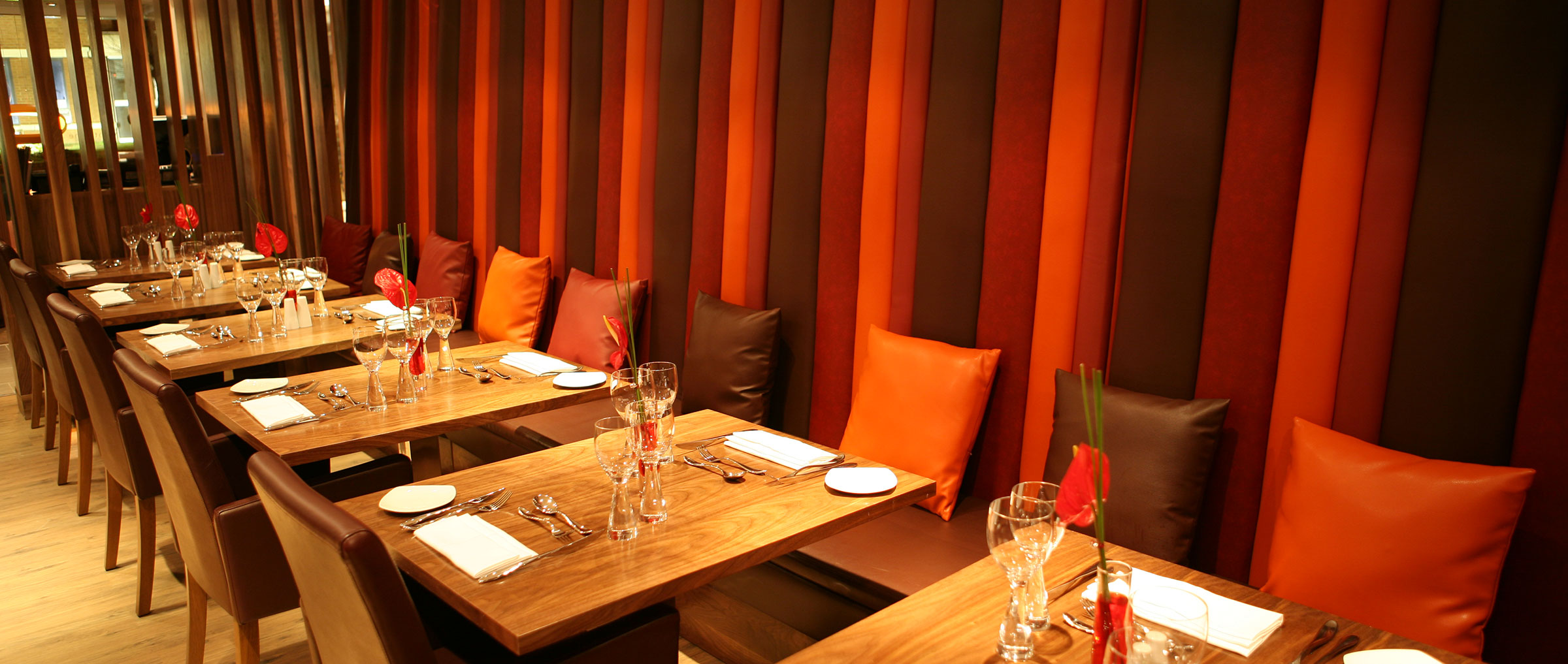 restaurant table and chairs with red interior design