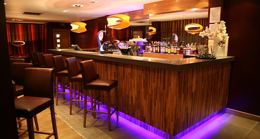 hotel bar with purple floor lighting