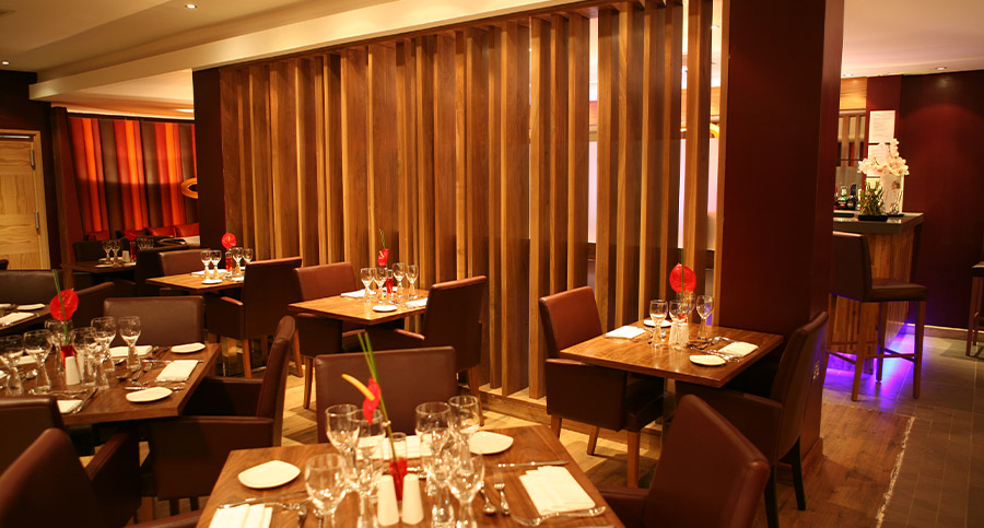 hotel restaurant table and chairs with wooden partition