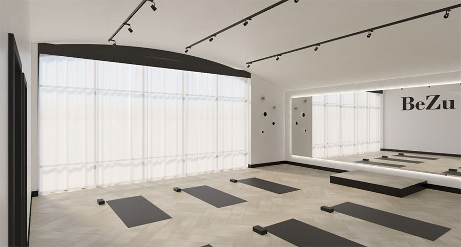 yoga studio interior design with mirror wall and tall windows