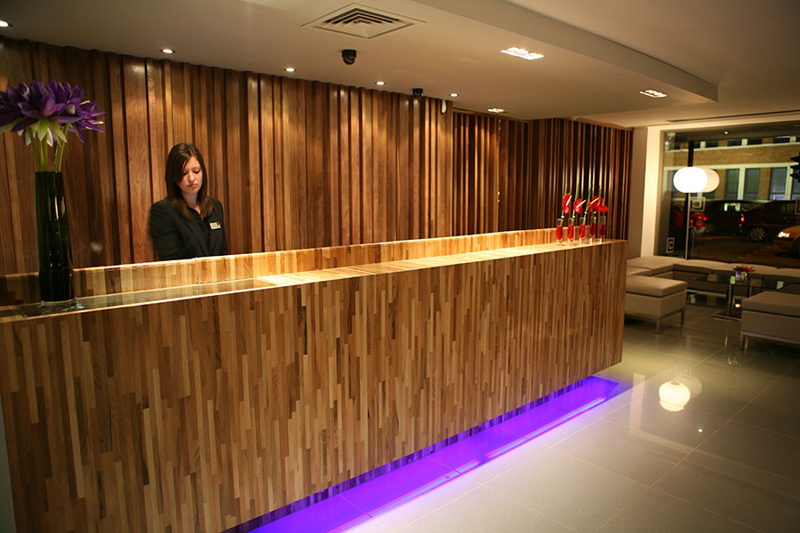 receptionist working at a hotel reception
