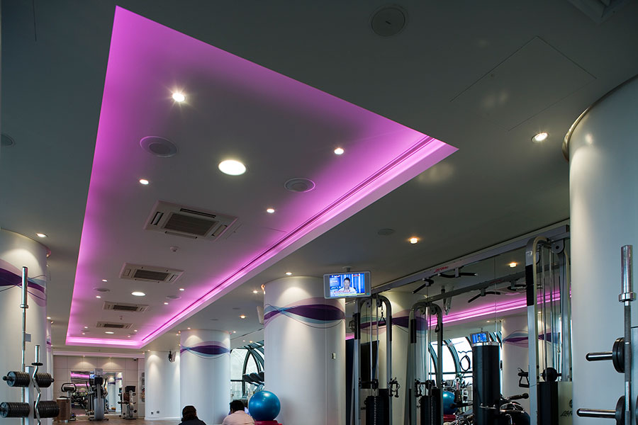 purple lit ceiling in a fitness club