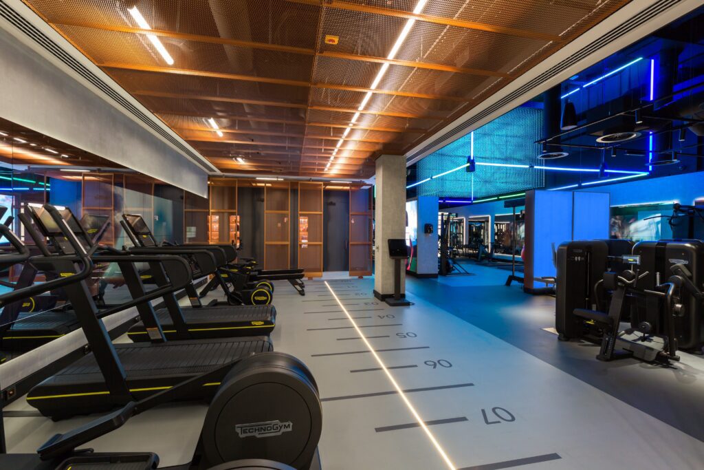 Gym interior design with technogym equipment and LED lighting