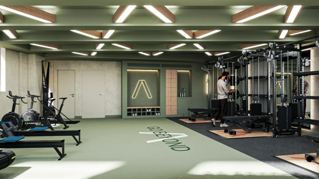 Fitness area with sage green floor and ceiling, cross-patterned ceiling lighting, and equipment including lifting racks.